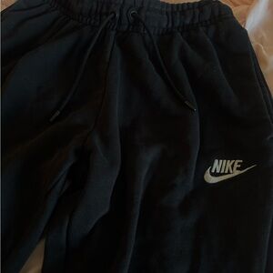 black Nike Club Fleece joggers with a tapered fit and elastic cuff